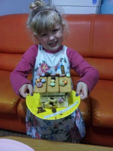 Very proud of her "gwaja-jib" (gingerbread house).